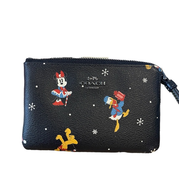 Coach Handbags - DISNEY COACH CORNER ZIP WRISTLET 
WITH HOLIDAY PRINT